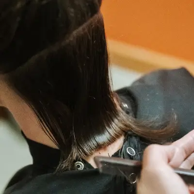 Woman getting her hair cut